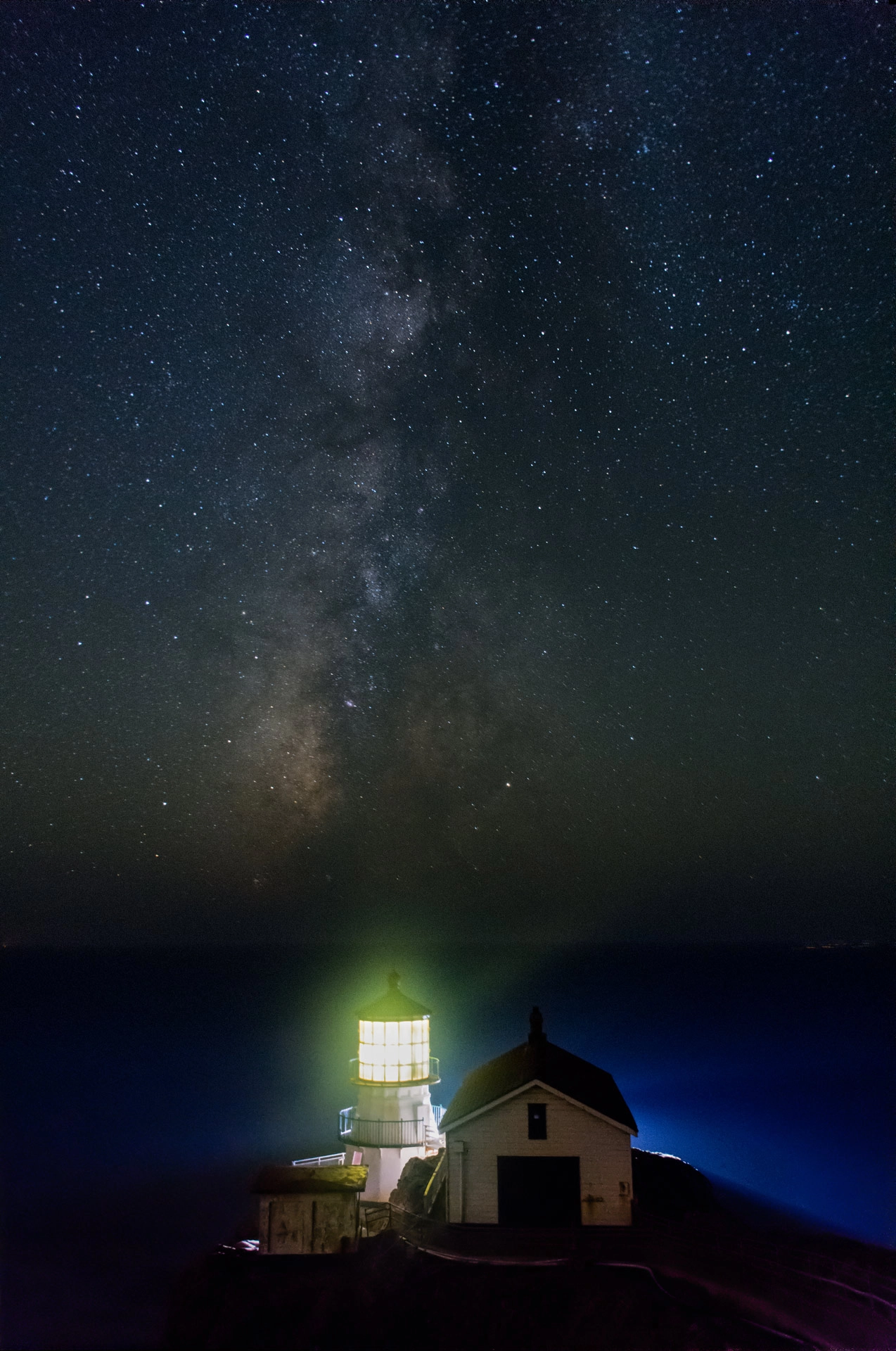 milky way behind lighthouse